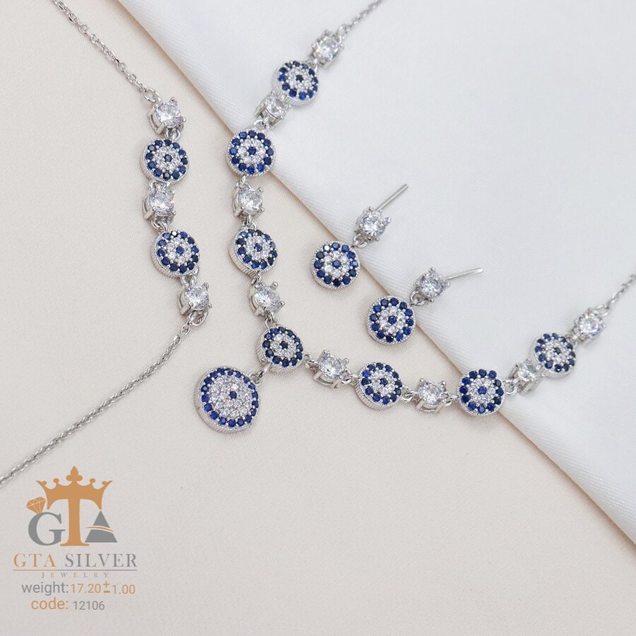 02451c03-c15a-48b4-9518-2d0796db8013.jpg سرویس نقره میکرو زنجیری طرح چشم نظر کد 12106 - Image 1