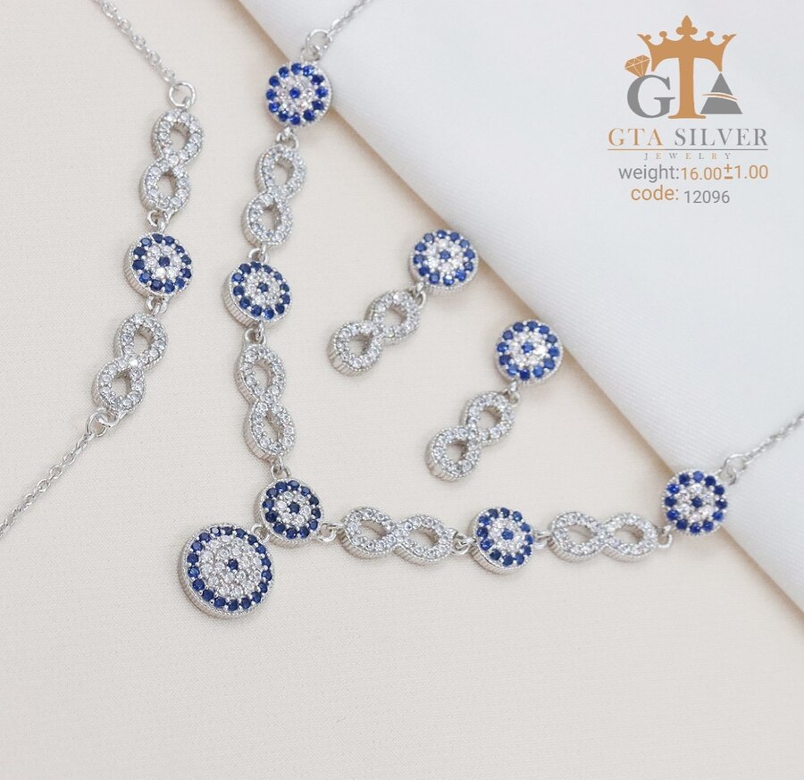 0378d599-f707-4fb6-bea5-bc266da82829.jpg سرویس نقره میکرو زنجیری طرح چشم نظر کد 12096 - Image 1