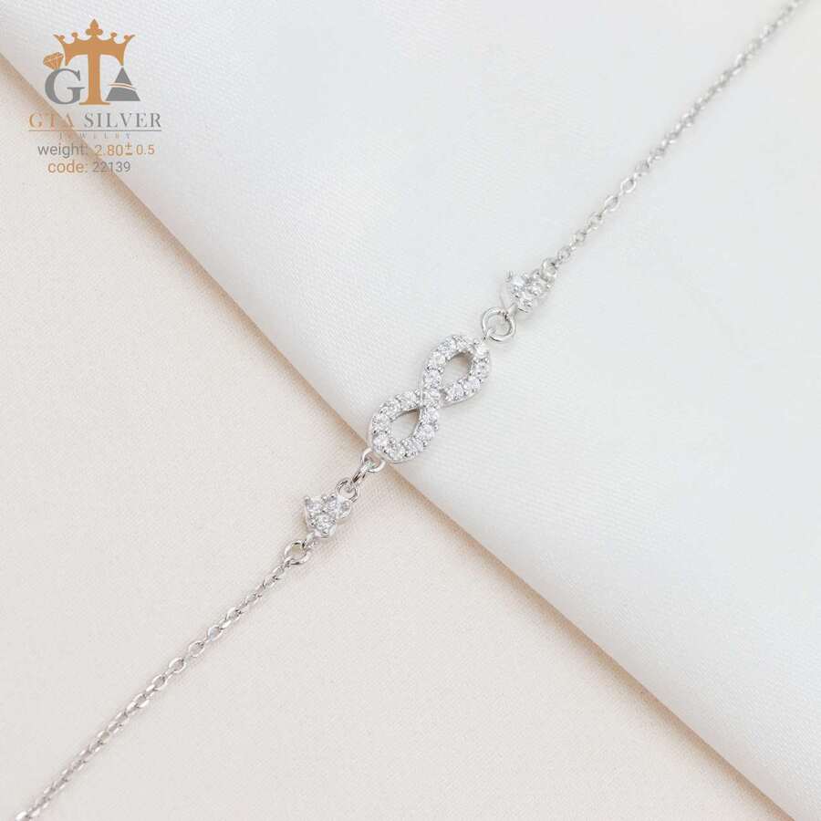 0b33ed49-4f2e-43bd-9bf3-1fe5418df782.jpg دستبند نقره زنانه میکرو طرح بینهایت کد 22139 - تصویر 1