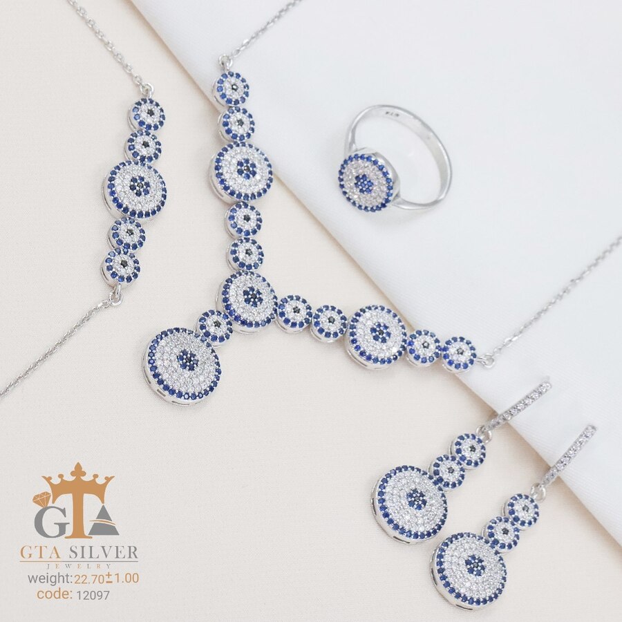 1b5998e0-ec2d-411b-aef5-5bd21e8d3ce1.jpg سرویس نقره میکرو زنجیری طرح چشم نظر کد 12097 - Image 1