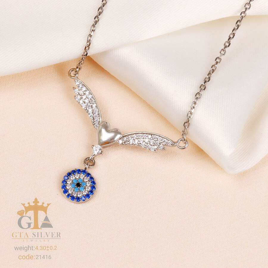 6787b4dd-5a92-4309-aad2-856c95fbf938.jpg مدال نقره طرح قلب بالدار و چشم نظر کد 21416 - Image 1