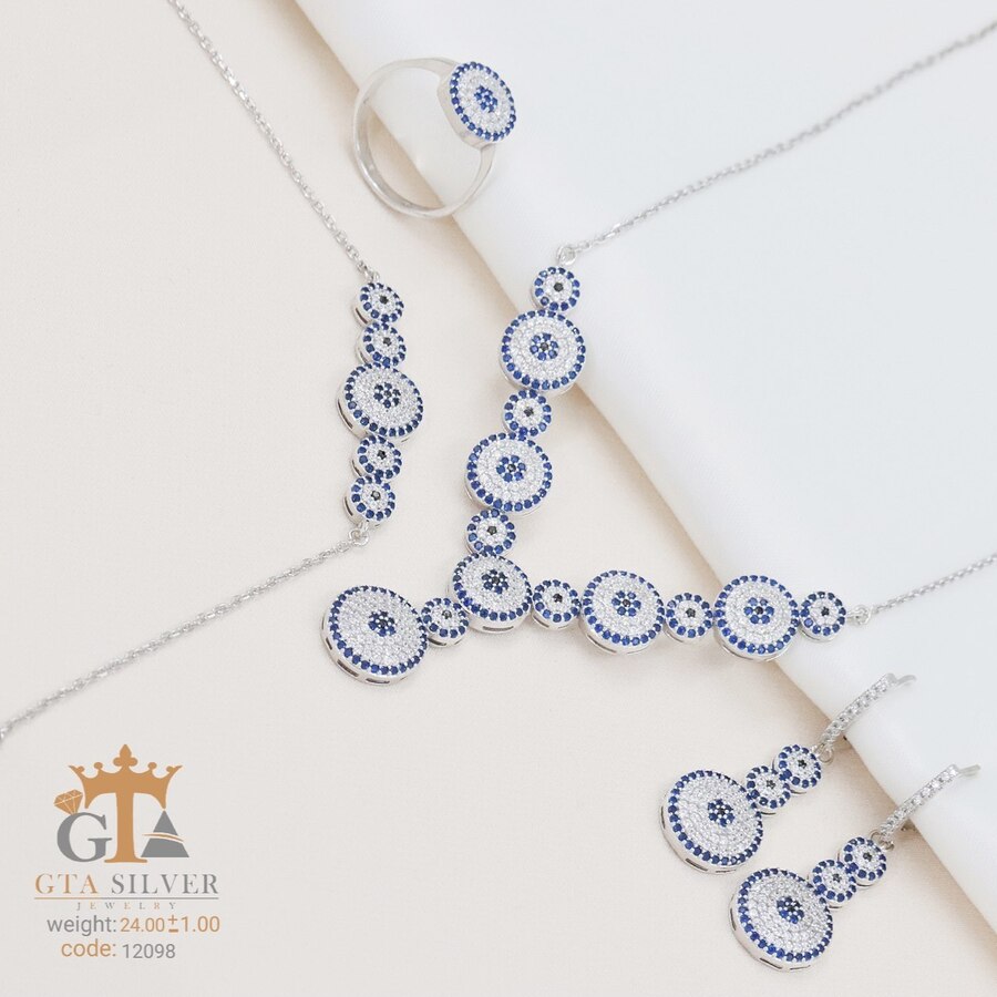 82fe954f-64f8-4a05-979d-dffbac21e71b.jpg سرویس نقره میکرو زنجیری طرح چشم نظر کد 12098 - تصویر 1