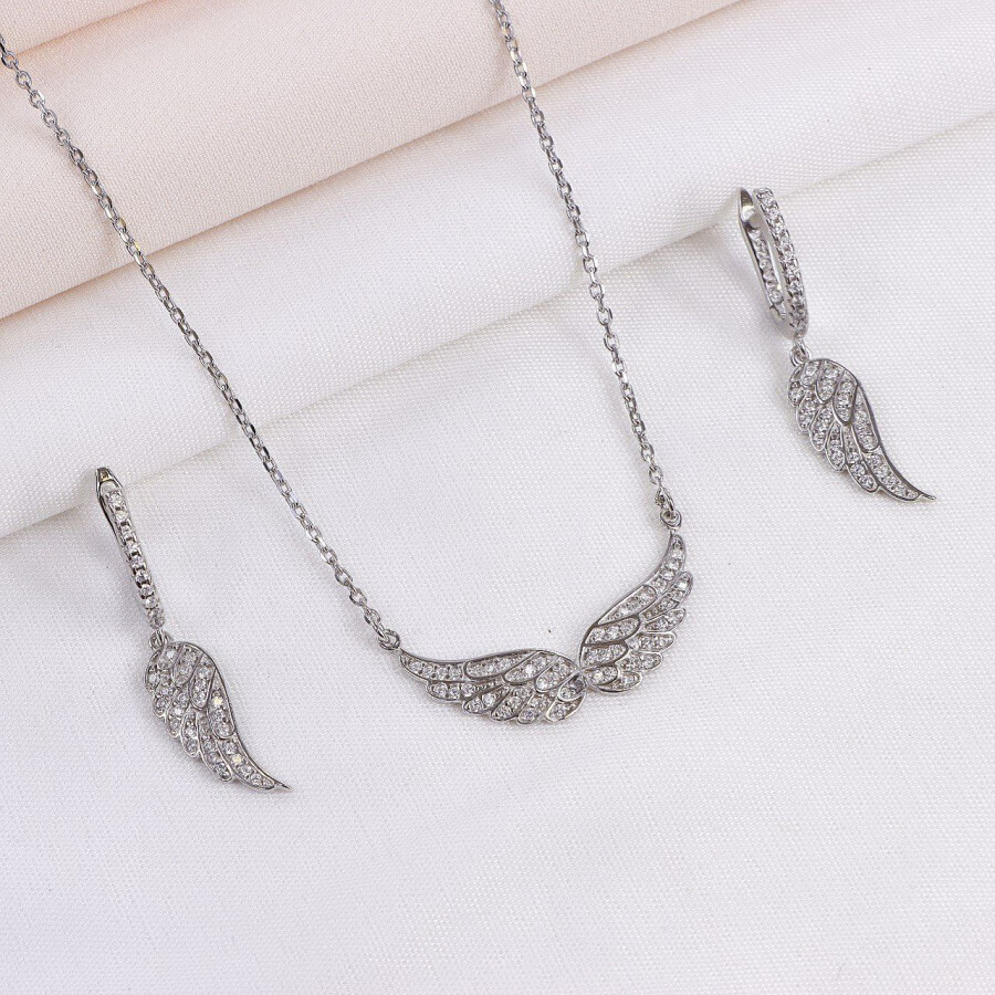 b74b469a-2365-43f9-b83c-4c9a43f43eb7.jpg نیم ست نقره میکرو طرح بال کد 16314 - تصویر 1