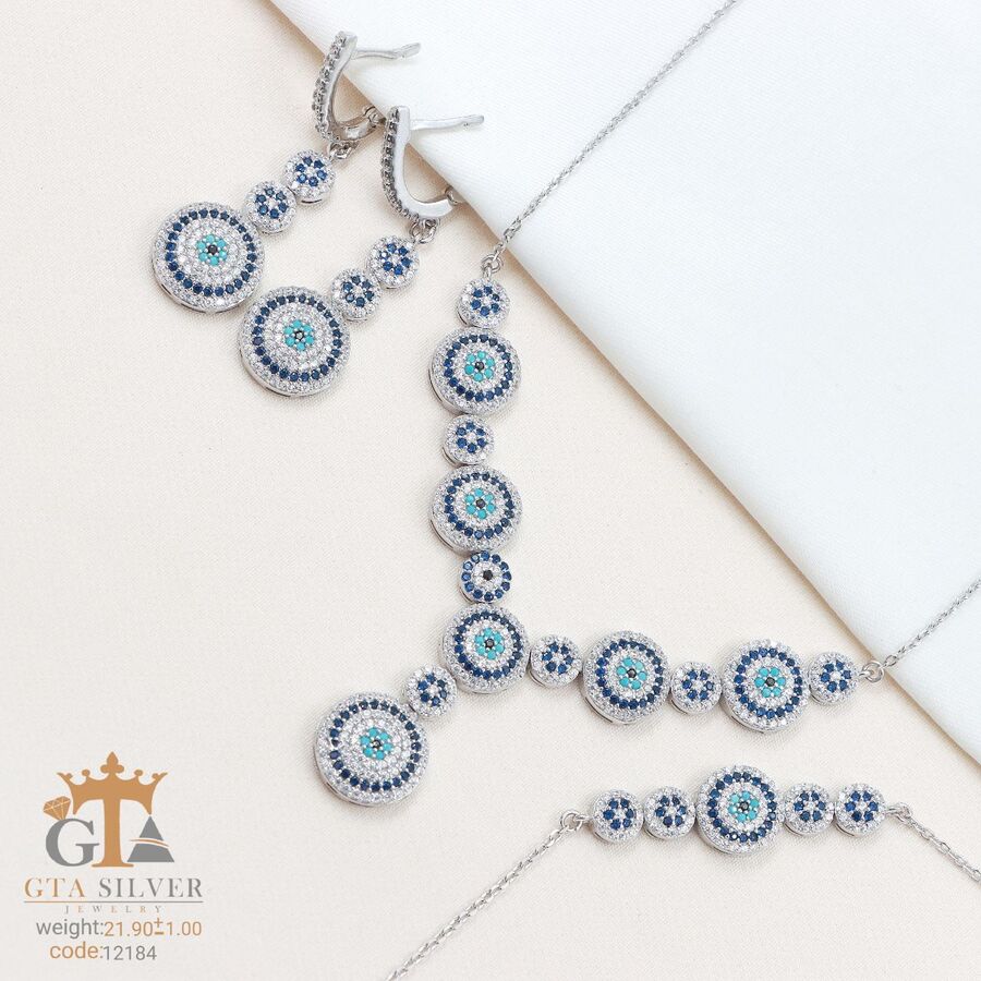 d709e969-3f9f-4706-80ba-b010a1b601a4.jpg سرویس نقره میکرو زنجیری طرح چشم نظر کد 12184 - تصویر 1